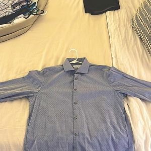 Calvin Klein, Slim Fit, light blue button down shirt. Size Large (16 - 34/35)